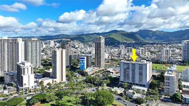 drone / aerial view featuring a city view and a mountain view