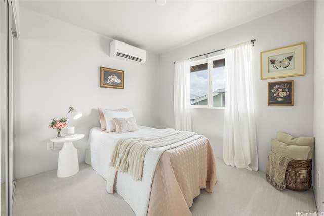 bedroom featuring light colored carpet and a wall unit AC
