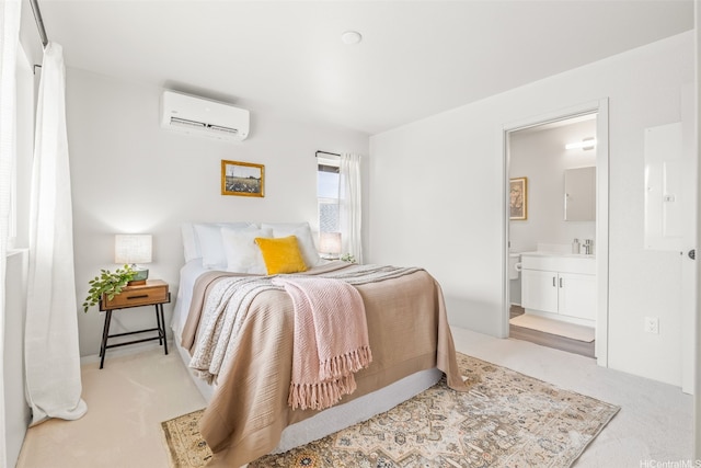 carpeted bedroom with connected bathroom and an AC wall unit