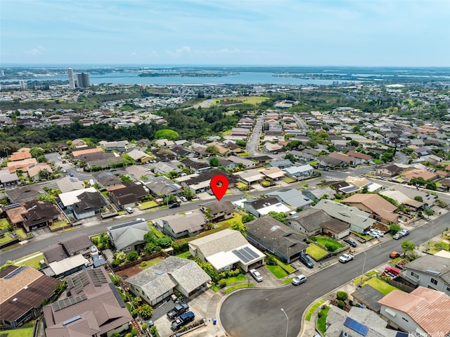 drone / aerial view with a residential view and a water view