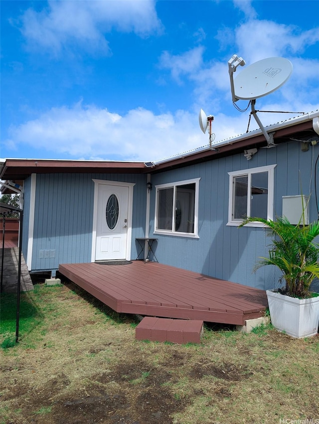 back of property with a deck