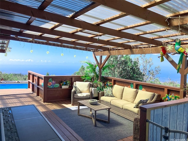 wooden deck featuring outdoor lounge area, a pergola, and a pool