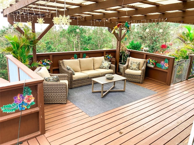 wooden terrace with a pergola and outdoor lounge area