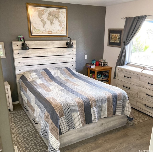 bedroom with wood finished floors