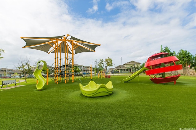 communal playground featuring a lawn