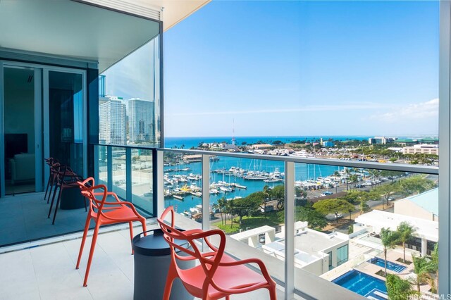 1118 Ala Moana Blvd Unit 1203, Honolulu, HI 96814 - balcony featuring a water view and a city view