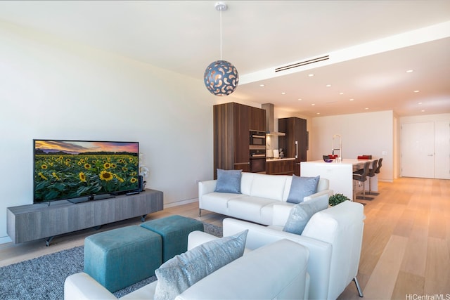 1118 Ala Moana Blvd Unit 1203, Honolulu, HI 96814 - living area with recessed lighting, light wood-style flooring, and visible vents