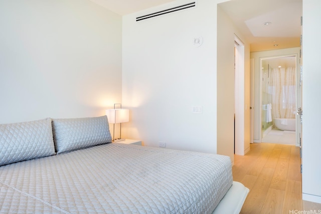 1118 Ala Moana Blvd Unit 1203, Honolulu, HI 96814 - bedroom featuring light wood-type flooring and visible vents