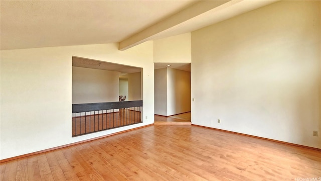 empty room featuring wood finished floors and baseboards
