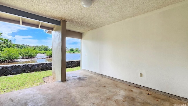view of patio featuring a water view