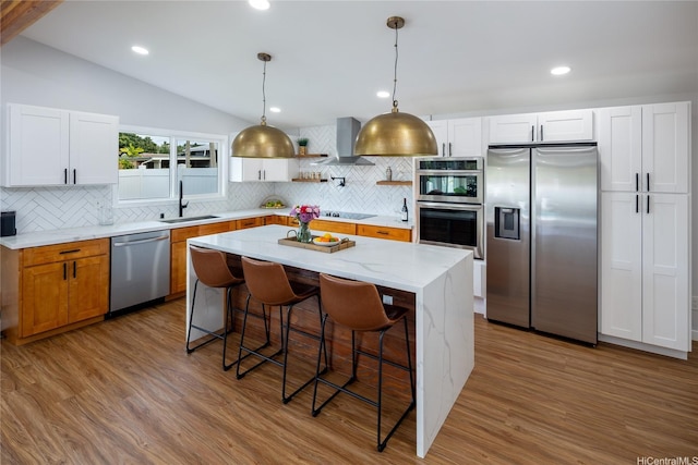 1242 Auwaiku St, Kailua, HI 96734 - kitchen with stainless steel appliances, a sink, wall chimney range hood, lofted ceiling, and backsplash