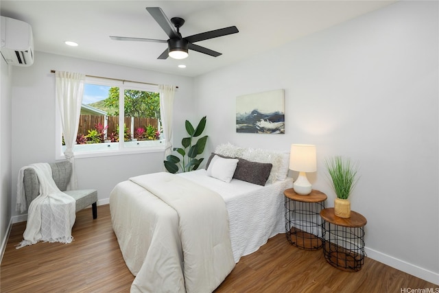 1242 Auwaiku St, Kailua, HI 96734 - bedroom featuring an AC wall unit, baseboards, wood finished floors, recessed lighting, and ceiling fan
