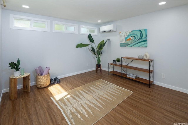 1242 Auwaiku St, Kailua, HI 96734 - living area with an AC wall unit, wood finished floors, baseboards, and recessed lighting