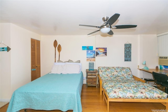 1700 Ala Moana Blvd Unit 1602, Honolulu, HI 96815 - bedroom with ceiling fan, a closet, and wood finished floors