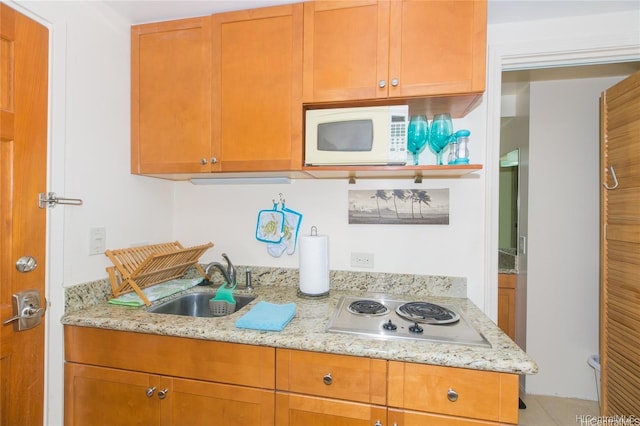 1700 Ala Moana Blvd Unit 1602, Honolulu, HI 96815 - kitchen featuring a sink, stainless steel electric cooktop, white microwave, and light stone countertops