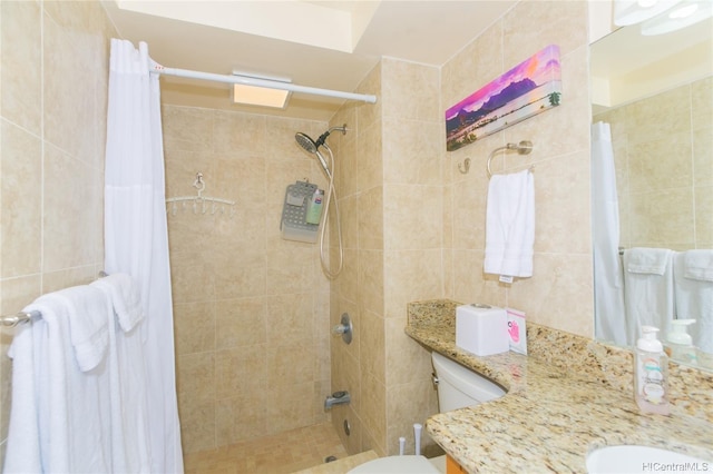 1700 Ala Moana Blvd Unit 1602, Honolulu, HI 96815 - bathroom featuring toilet, tile walls, tiled shower, and vanity