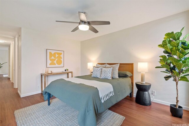 1015 Aoloa Pl Unit 258, Kailua, HI 96734 - bedroom with baseboards, a ceiling fan, and wood finished floors