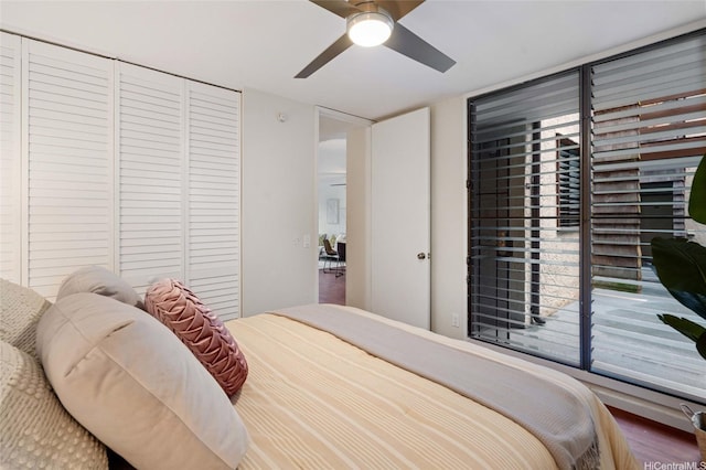 1015 Aoloa Pl Unit 258, Kailua, HI 96734 - bedroom with ceiling fan, a closet, and wood finished floors