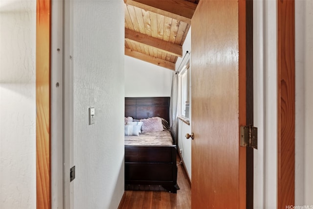 bedroom with wooden ceiling, lofted ceiling with beams, and dark wood-type flooring