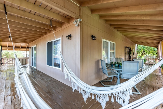 wooden deck featuring outdoor dining area