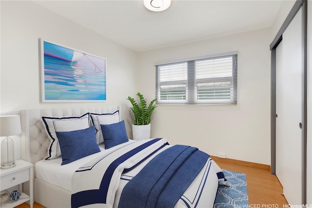 bedroom featuring wood finished floors