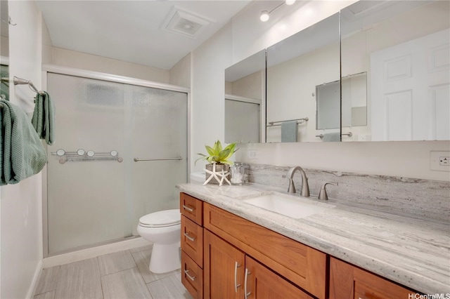 full bathroom with vanity, visible vents, toilet, and a shower stall