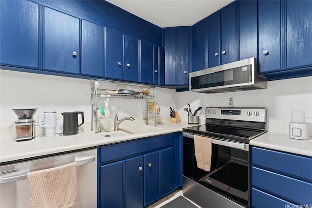 46-259 Kahuhipa St Unit 318B, Kaneohe, HI 96744 - kitchen with light countertops, a sink, appliances with stainless steel finishes, and blue cabinetry