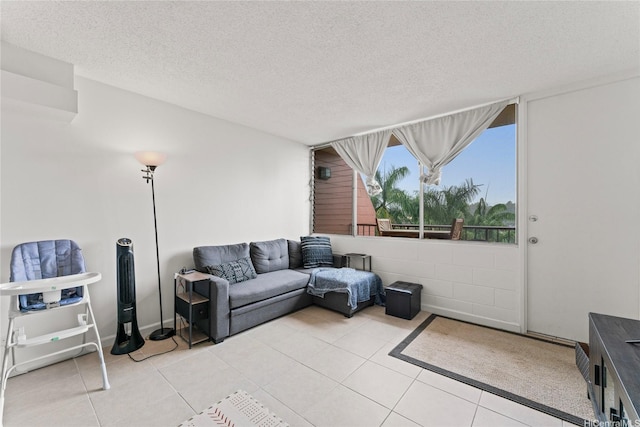 46-259 Kahuhipa St Unit 318B, Kaneohe, HI 96744 - living room with light tile patterned floors and a textured ceiling