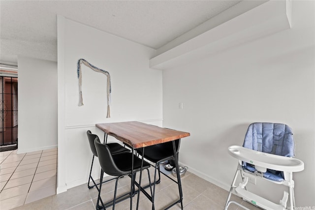 46-259 Kahuhipa St Unit 318B, Kaneohe, HI 96744 - tiled dining room with baseboards and a textured ceiling