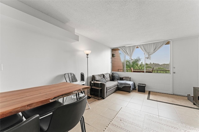 46-259 Kahuhipa St Unit 318B, Kaneohe, HI 96744 - living room featuring a textured ceiling and light tile patterned floors