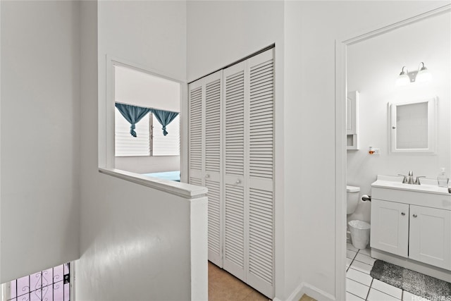 46-259 Kahuhipa St Unit 318B, Kaneohe, HI 96744 - bathroom featuring vanity, a closet, tile patterned floors, and toilet