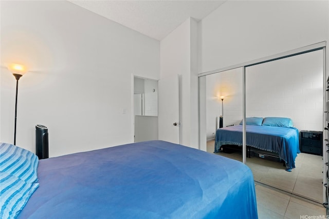 46-259 Kahuhipa St Unit 318B, Kaneohe, HI 96744 - bedroom with light tile patterned flooring, lofted ceiling, and a closet