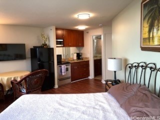 1700 Ala Moana Blvd Unit 3101, Honolulu, HI 96815 - bedroom featuring freestanding refrigerator and dark wood finished floors