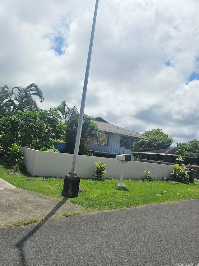 55-506 Iosepa St, Laie, HI 96762 - view of front of home featuring board and batten siding, fence private yard, and a front yard