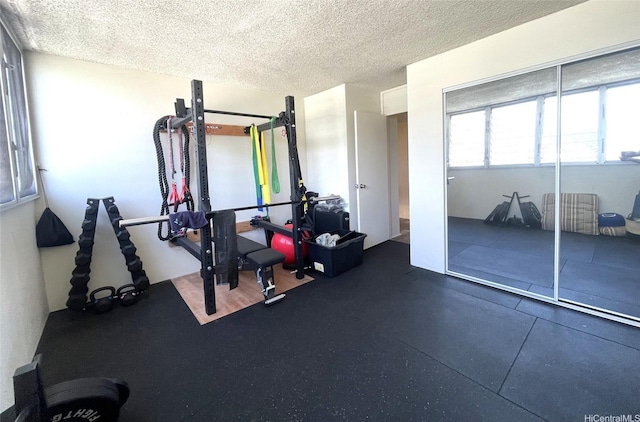 500 University Ave Unit 704, Honolulu, HI 96826 - workout area featuring a textured ceiling