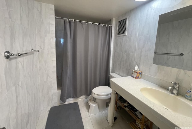 500 University Ave Unit 704, Honolulu, HI 96826 - bathroom featuring tile walls, toilet, curtained shower, tile patterned flooring, and vanity