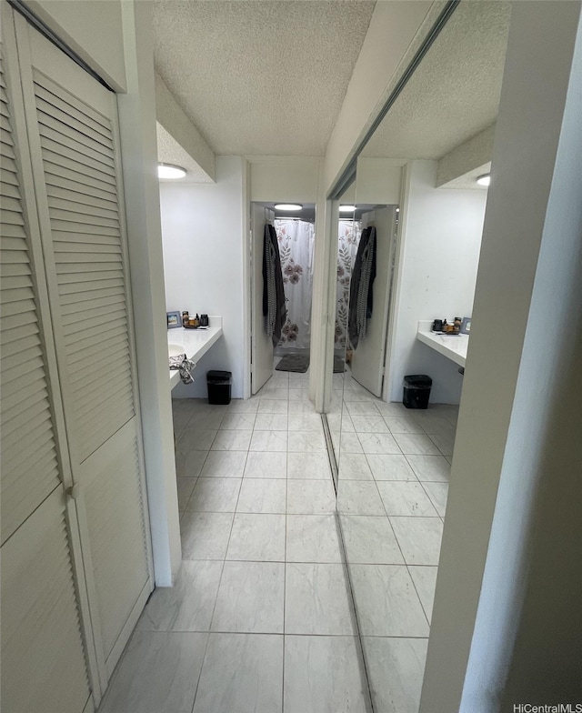 500 University Ave Unit 704, Honolulu, HI 96826 - hallway with a textured ceiling