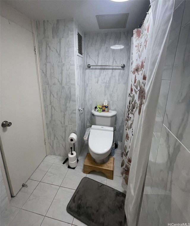 500 University Ave Unit 704, Honolulu, HI 96826 - full bath with toilet, tile patterned flooring, tile walls, and a shower with curtain