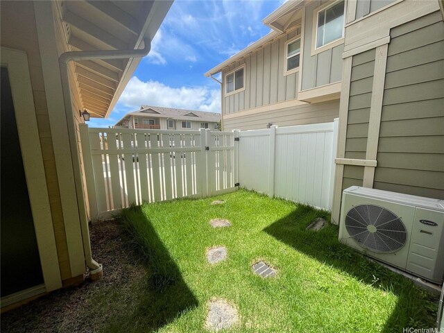 91-960 Iwikuamoo St Unit 304, Ewa Beach, HI 96706 - view of front of house with fence, an attached garage, board and batten siding, and concrete driveway