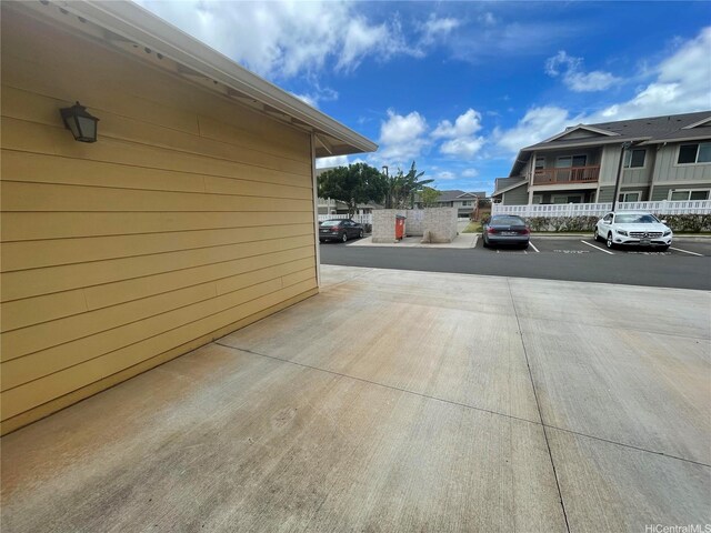 91-960 Iwikuamoo St Unit 304, Ewa Beach, HI 96706 - view of home's exterior with uncovered parking