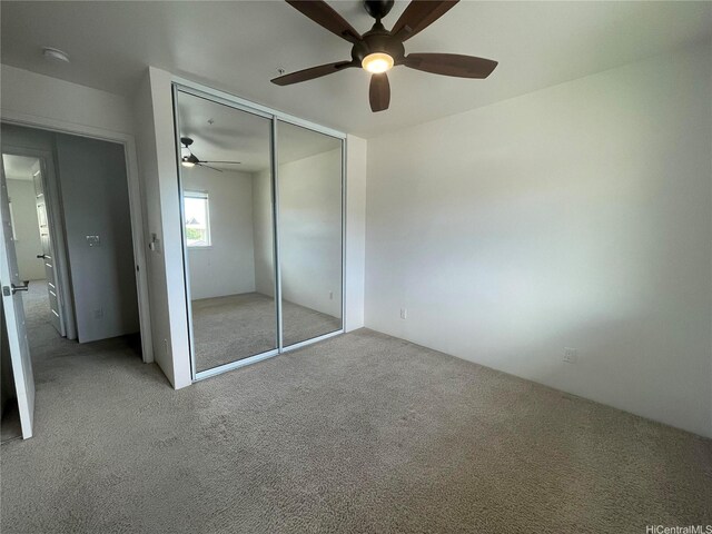 91-960 Iwikuamoo St Unit 304, Ewa Beach, HI 96706 - unfurnished bedroom with a closet, ceiling fan, and carpet flooring