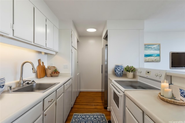 2600 Pualani Way Unit 3102, Honolulu, HI 96815 - kitchen with white appliances, a sink, dark wood-type flooring, white cabinetry, and light countertops