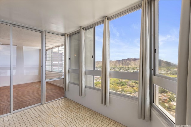 2600 Pualani Way Unit 3102, Honolulu, HI 96815 - unfurnished sunroom with a mountain view and tile patterned floors