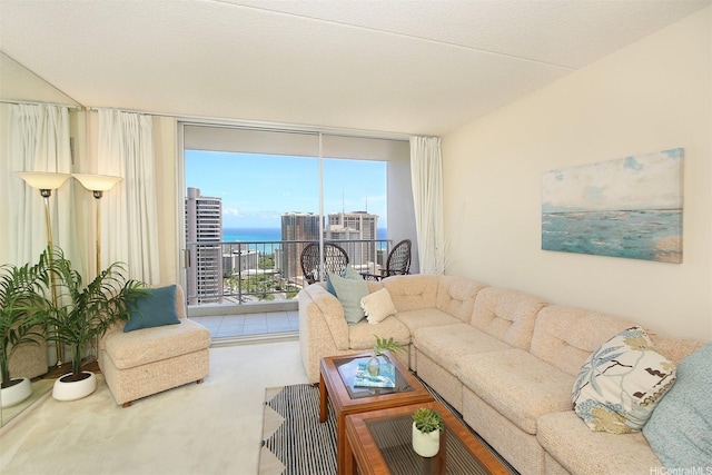 living room with a water view and floor to ceiling windows