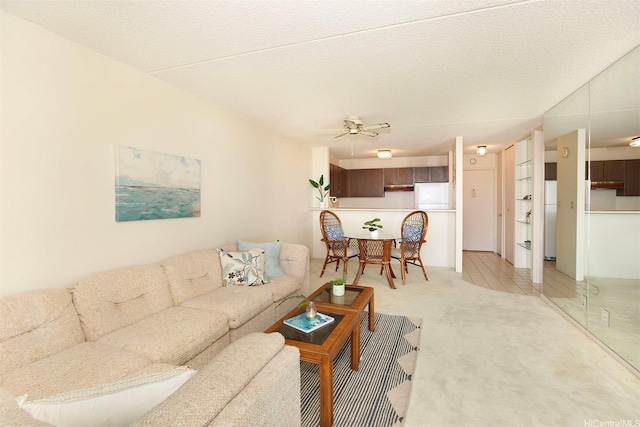 living room with light carpet and ceiling fan