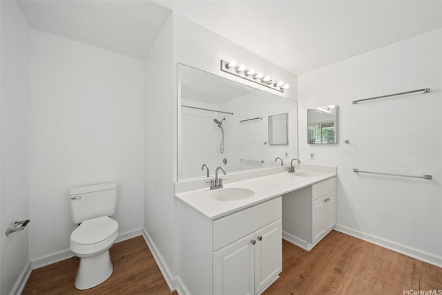 94-831 Lumiauau St Unit H104, Waipahu, HI 96797 - bathroom with a sink, double vanity, toilet, and wood finished floors