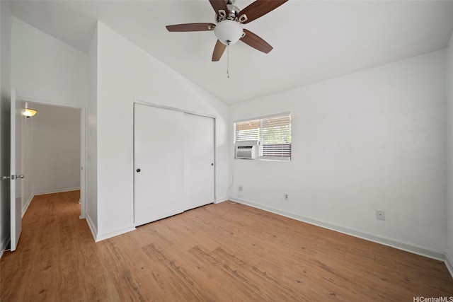 94-831 Lumiauau St Unit H104, Waipahu, HI 96797 - unfurnished bedroom with a closet, baseboards, vaulted ceiling, and light wood-type flooring