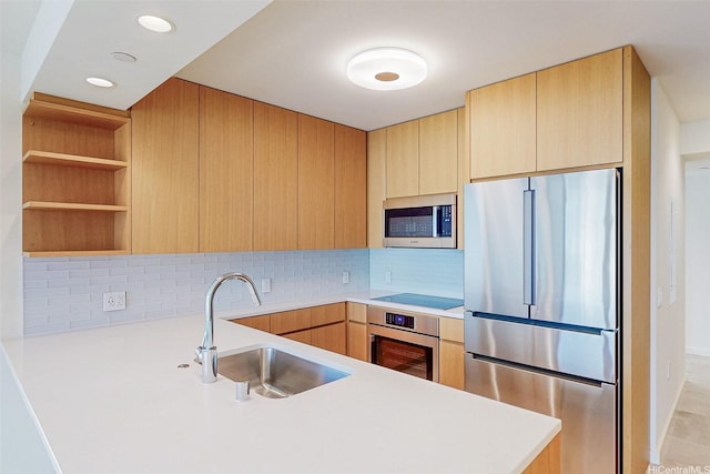 1388 Kapiolani Blvd Unit 2209, Honolulu, HI 96814 - kitchen featuring light brown cabinets, stainless steel appliances, a sink, a peninsula, and light countertops