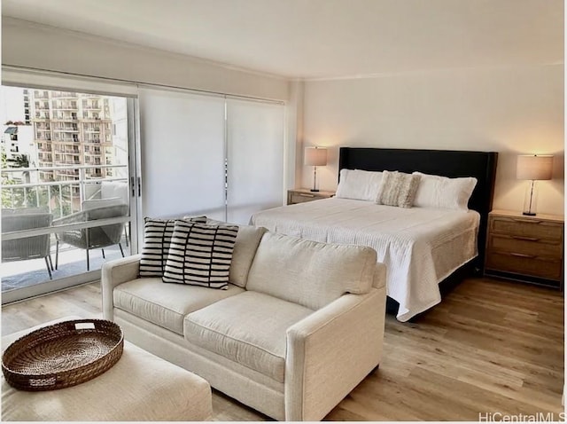 1777 Ala Moana Blvd Unit 901, Honolulu, HI 96815 - bedroom with crown molding, a closet, wood finished floors, and access to exterior