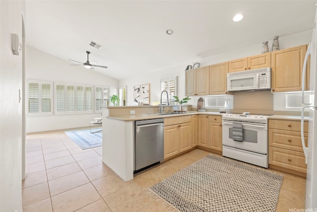91-1023 Kai Weke St, Ewa Beach, HI 96706 - kitchen with a sink, light brown cabinetry, light tile patterned floors, and white appliances